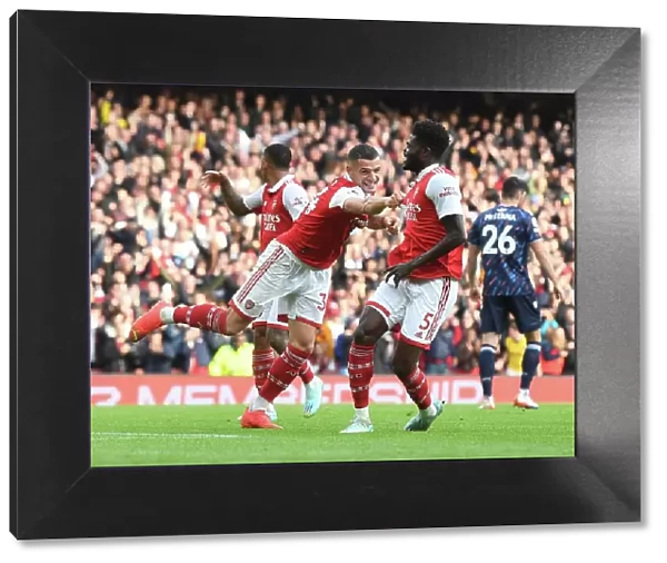 Thomas Partey and Granit Xhaka Celebrate Arsenal's Fourth Goal vs. Nottingham Forest (2022-23)