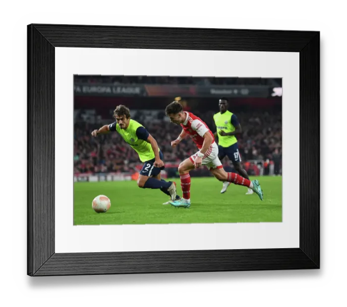Framed Print : Arsenal vs FC Zurich: Kieran Tierney Clashes with Lindrit Kamberi in UEFA Europa League Group A Match