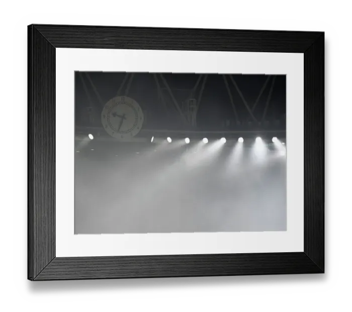 Framed Print : Europa League: Smoke-Filled Clock End as Arsenal Battle FC Zurich at Emirates Stadium