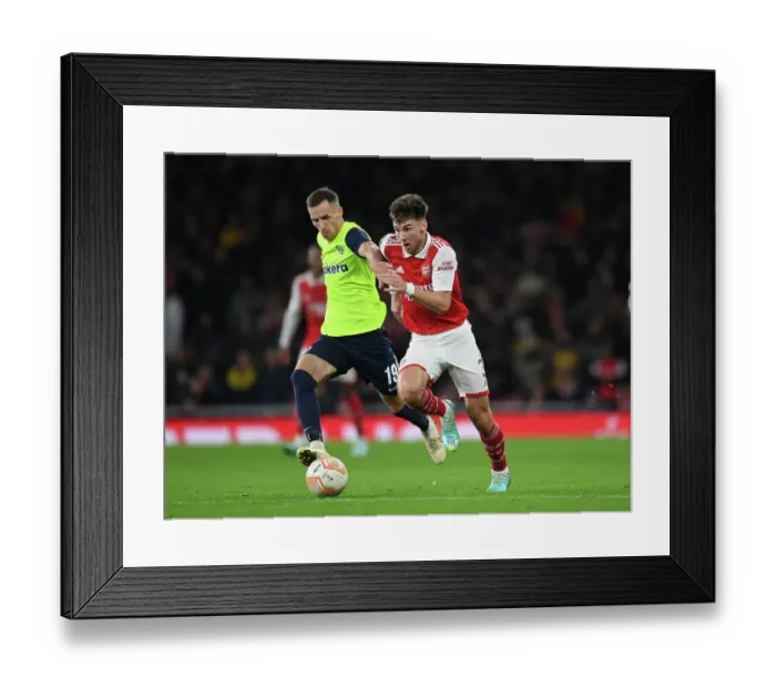 Framed Print : Arsenal vs FC Zurich: Kieran Tierney Clashes in UEFA Europa League Group A