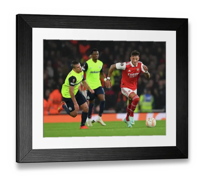 Framed Print : Arsenal's Ben White vs. Adrian Guerrero: A Europa League Showdown in North London