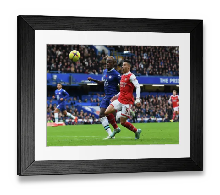 Framed Print : Clash at Stamford Bridge: Gabriel Martinelli vs. Trevoh Chalobah - Chelsea vs. Arsenal, Premier League 2022-23