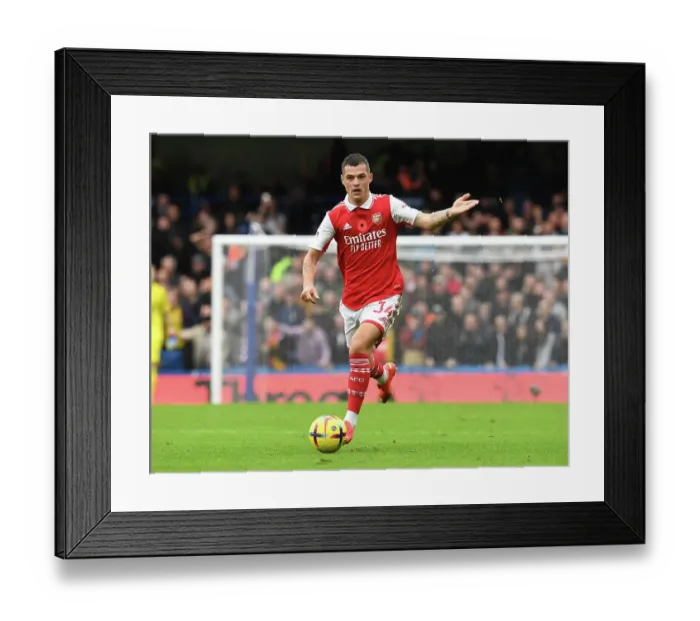Framed Print : Granit Xhaka: Battle at the Bridge - Chelsea vs. Arsenal 2022-23, Premier League Showdown Framed Print : Granit Xhaka: Battle at the Bridge - Chelsea vs. Arsenal 2022-23, Premier League Showdown