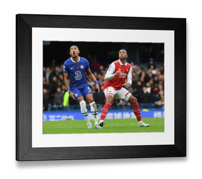 Framed Print : Gabriel Magalhaes vs. Pierre-Emerick Aubameyang: Intense Rivalry at Stamford Bridge - Chelsea vs. Arsenal, Premier League 2022-23