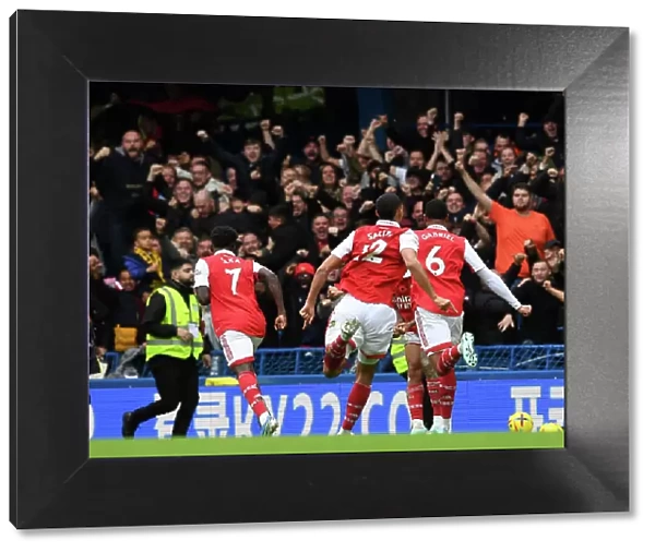 Arsenal's Magalhaes and Saka Celebrate Goal Against Chelsea in 2022-23 Premier League