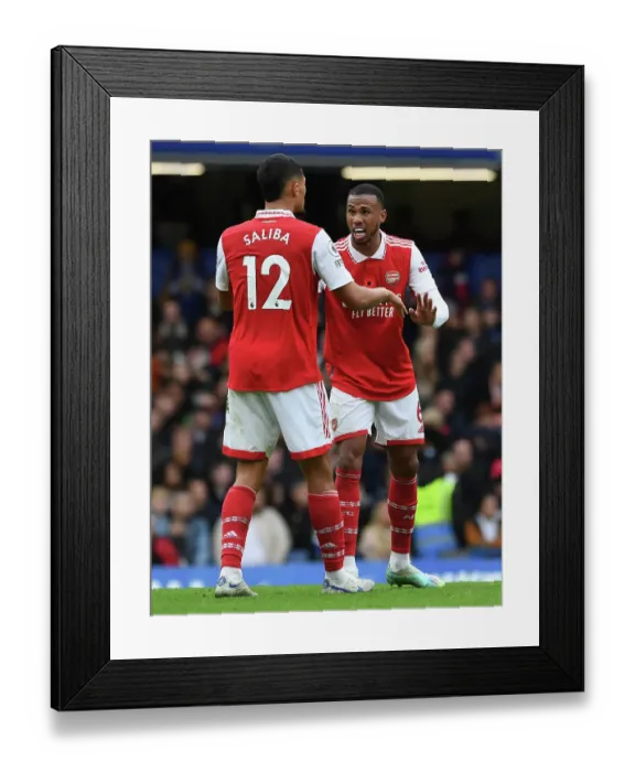 Framed Print : Arsenal's Saliba and Magalhaes Face Off Against Chelsea in Premier League Showdown (2022-23)