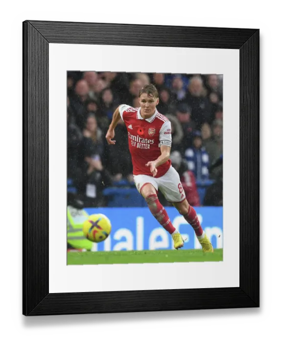 Framed Print : Martin Odegaard Faces Off Against Chelsea in the 2022-23 Premier League Clash Framed Print : Martin Odegaard Faces Off Against Chelsea in the 2022-23 Premier League Clash