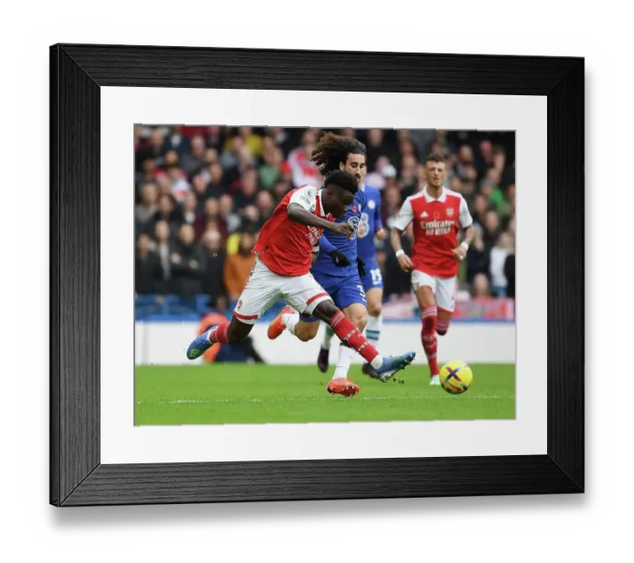 Framed Print : Saka vs. Cucurella: A Premier League Showdown at Stamford Bridge Framed Print : Saka vs. Cucurella: A Premier League Showdown at Stamford Bridge