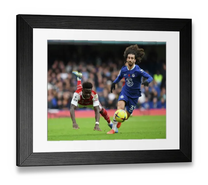 Framed Print : Clash at Stamford Bridge: Arsenal's Bukayo Saka Faces Off Against Chelsea's Marc Cucurella in the Premier League Showdown Framed Print : Clash at Stamford Bridge: Arsenal's Bukayo Saka Faces Off Against Chelsea's Marc Cucurella in the Premier League Showdown
