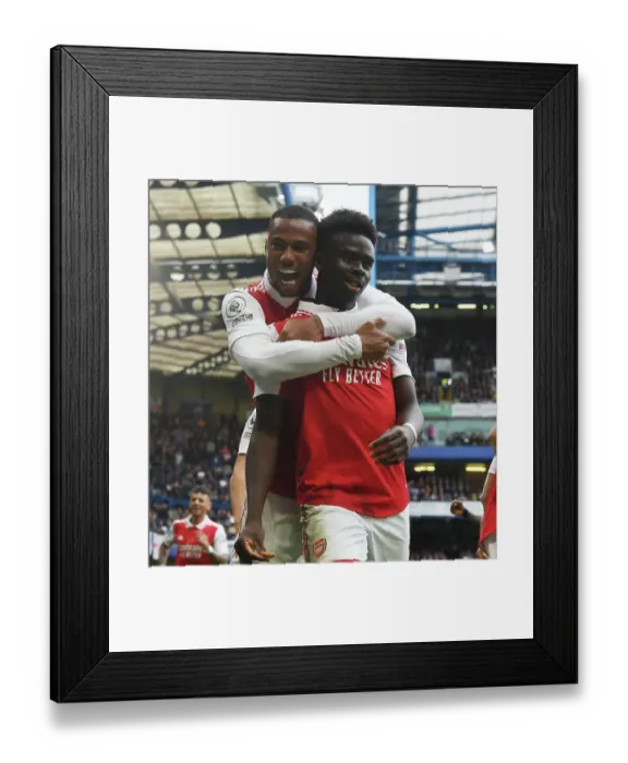 Framed Print : Gabriel and Saka Celebrate Arsenal's Goal Against Chelsea in Premier League Clash (2022-23)