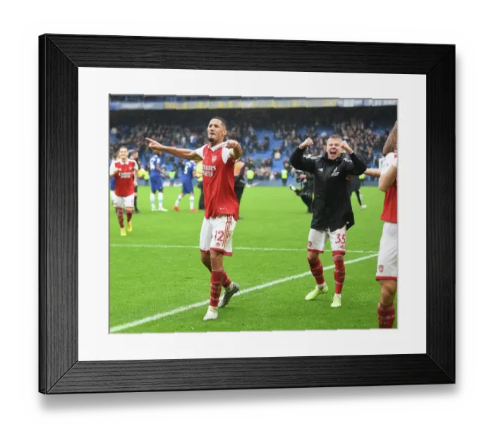 Framed Print : Arsenal's Triumph at Stamford Bridge: Saliba and Zinchenko's Jubilant Moment