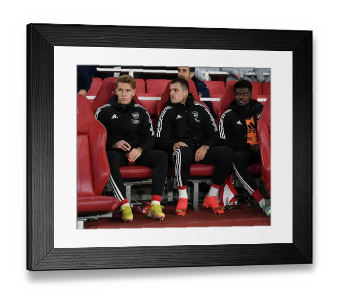 Framed Print : Arsenal's Midfield Trio: Odegaard, Xhaka, Partey on the Bench for Carabao Cup Match vs. Brighton