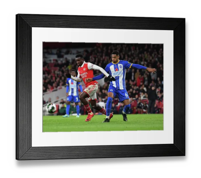 Framed Print : Nketiah vs Colwill: Intense Battle in Arsenal's Carabao Cup Clash Against Brighton