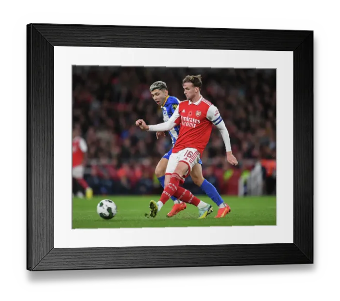 Framed Print : Arsenal vs Brighton: Tense Moment as Rob Holding Faces Pressure from Julio Enciso in Carabao Cup Clash Framed Print : Arsenal vs Brighton: Tense Moment as Rob Holding Faces Pressure from Julio Enciso in Carabao Cup Clash