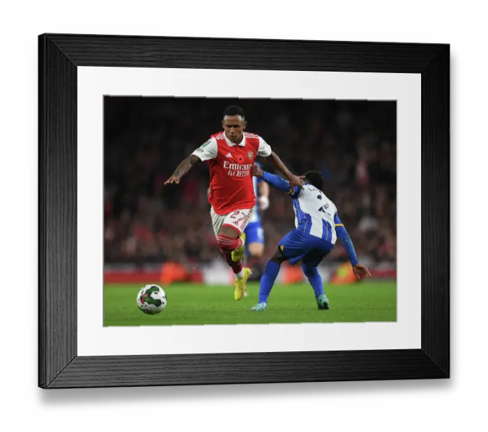 Framed Print : Arsenal's Marquinhos Outmaneuvers Brighton's Lamptey in Carabao Cup Clash