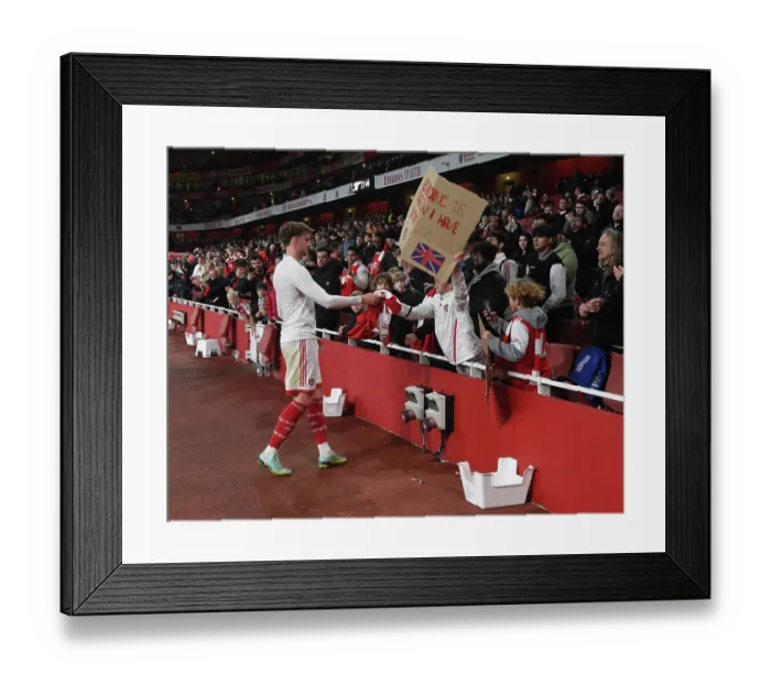 Framed Print : Arsenal's Rob Holding Gifts Shirt to Fan after Carabao Cup Win vs Brighton & Hove Albion