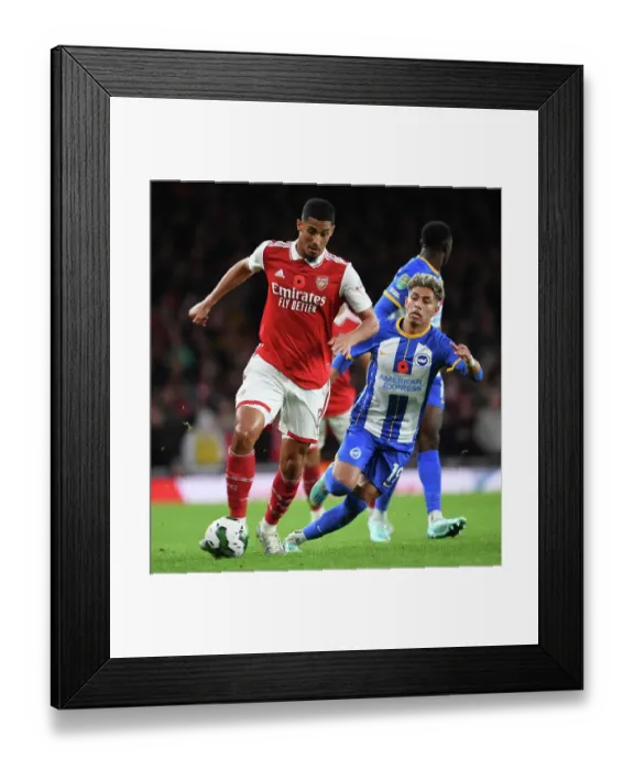 Framed Print : Arsenal's Saliba Outsmarts Brighton's Sarmiento in Carabao Cup Clash Framed Print : Arsenal's Saliba Outsmarts Brighton's Sarmiento in Carabao Cup Clash