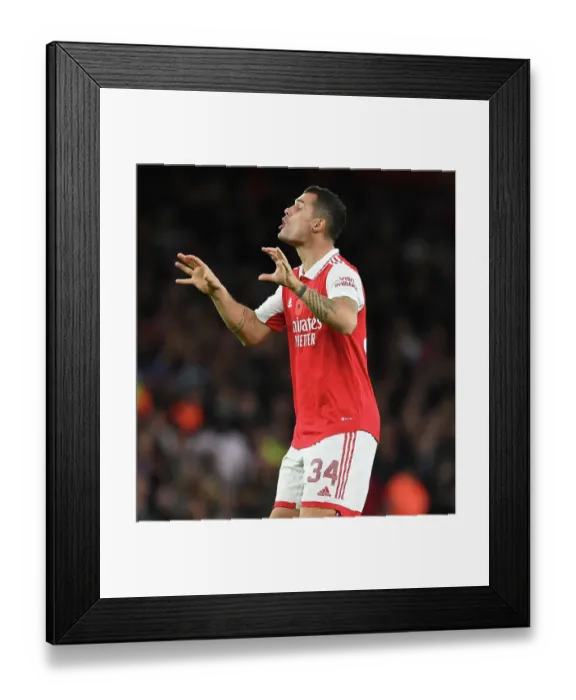 Framed Print : Granit Xhaka: Arsenal's Brilliant Midfield Performance Against Brighton in Carabao Cup