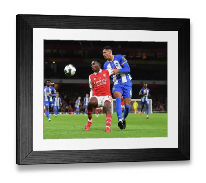 Framed Print : Nketiah vs Colwill: Intense Face-Off in Arsenal's Carabao Cup Battle Against Brighton