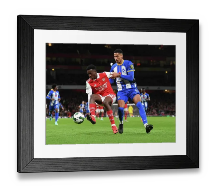 Framed Print : Arsenal's Eddie Nketiah Faces Off Against Brighton's Levi Colwill in Carabao Cup Clash