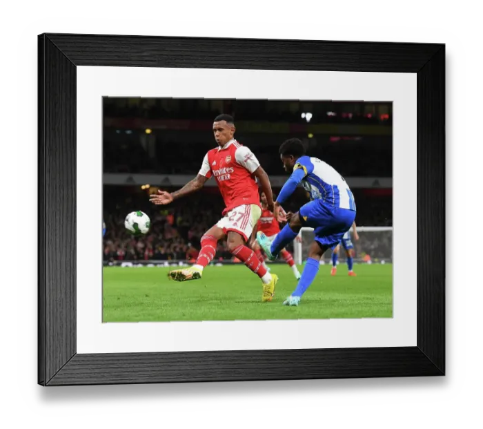 Framed Print : Arsenal vs Brighton: Marquinhos Challenges Lamptey in Carabao Cup Clash