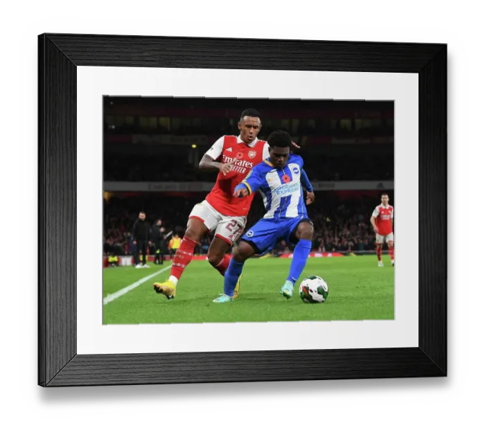 Framed Print : Marquinhos vs Lamptey: A Fierce Rivalry Unfolds in Arsenal's Carabao Cup Showdown Against Brighton
