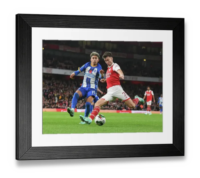 Framed Print : Arsenal vs Brighton & Hove Albion: Kieran Tierney Clashes with Jeremy Sarmiento in Carabao Cup Showdown