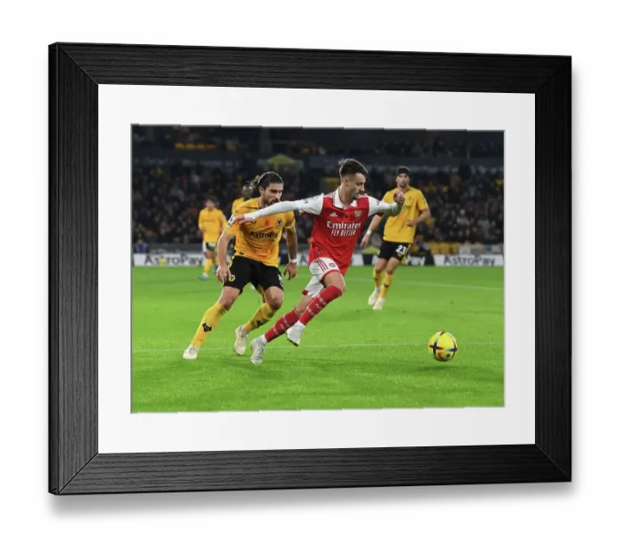 Framed Print : Fabio Vieira vs. Ruben Neves: Battle in the Midfield - Wolverhampton Wanderers vs. Arsenal FC, Premier League 2022-23