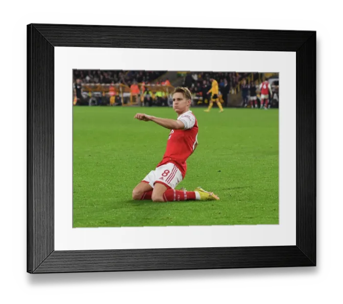 Framed Print : Martin Odegaard Scores Brace: Arsenal Triumphs Over Wolverhampton Wanderers in Premier League Clash (November 2022)