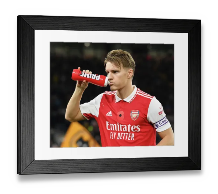 Framed Print : Martin Odegaard Gears Up: Wolverhampton Wanderers vs Arsenal FC, Premier League 2022-23