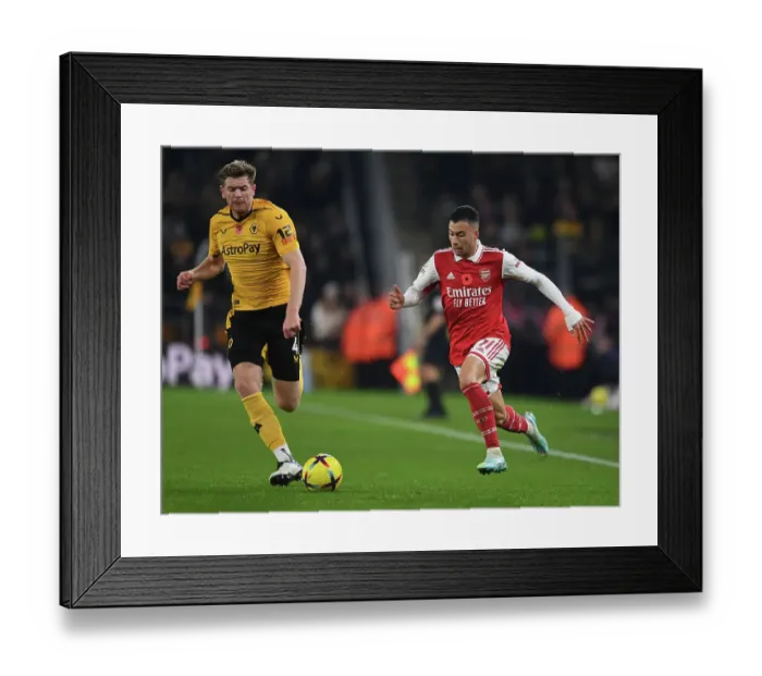 Framed Print : Martinelli vs Collins: A Football Battle at Molineux - Wolverhampton Wanderers vs Arsenal FC, Premier League 2022-23