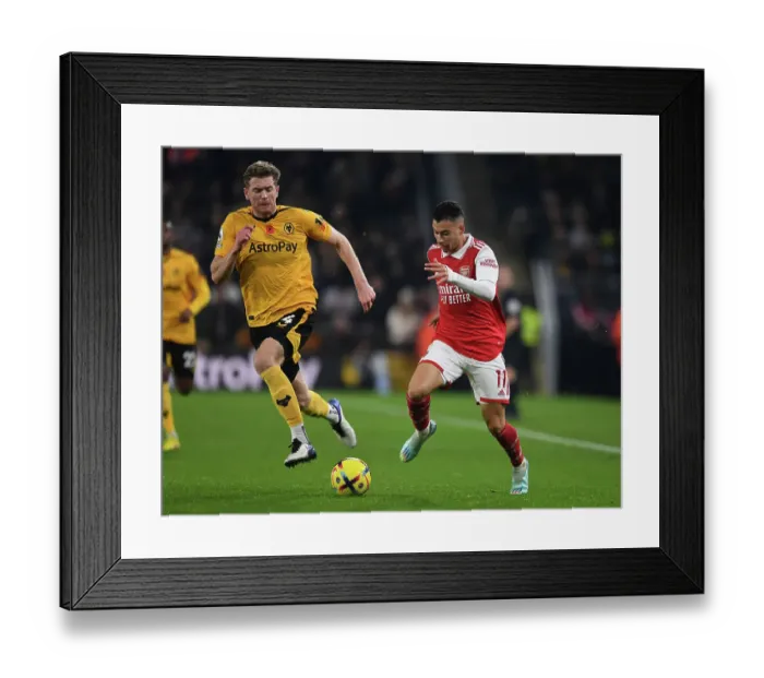 Framed Print : Martinelli vs Collins: A Football Showdown at Molineux - Wolverhampton Wanderers vs Arsenal FC, Premier League 2022-23