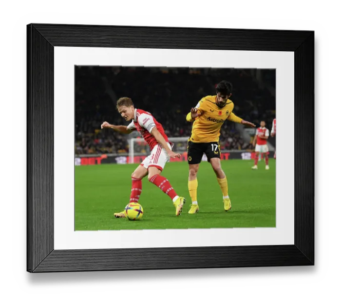Framed Print : Clash at Molineux: Martin Odegaard vs. Goncalo Guedes - Wolverhampton Wanderers vs. Arsenal FC, Premier League 2022-23 Framed Print : Clash at Molineux: Martin Odegaard vs. Goncalo Guedes - Wolverhampton Wanderers vs. Arsenal FC, Premier League 2022-23
