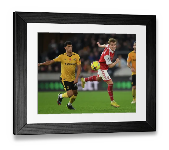 Framed Print : Martin Odegaard vs. Matheus Nunes: Heading Battle at Molineux - Wolverhampton Wanderers vs. Arsenal FC, Premier League 2022-23