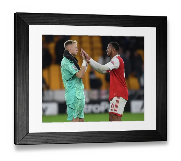 Framed Print : Arsenal's Gabriel Magalhaes and Aaron Ramsdale Celebrate Victory over Wolverhampton Wanderers in the 2022-23 Premier League