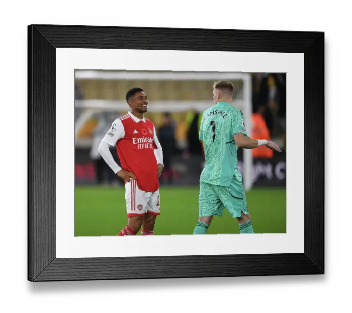 Framed Print : Arsenal's Reiss Nelson and Aaron Ramsdale Celebrate Victory Over Wolverhampton Wanderers in 2022-23 Premier League