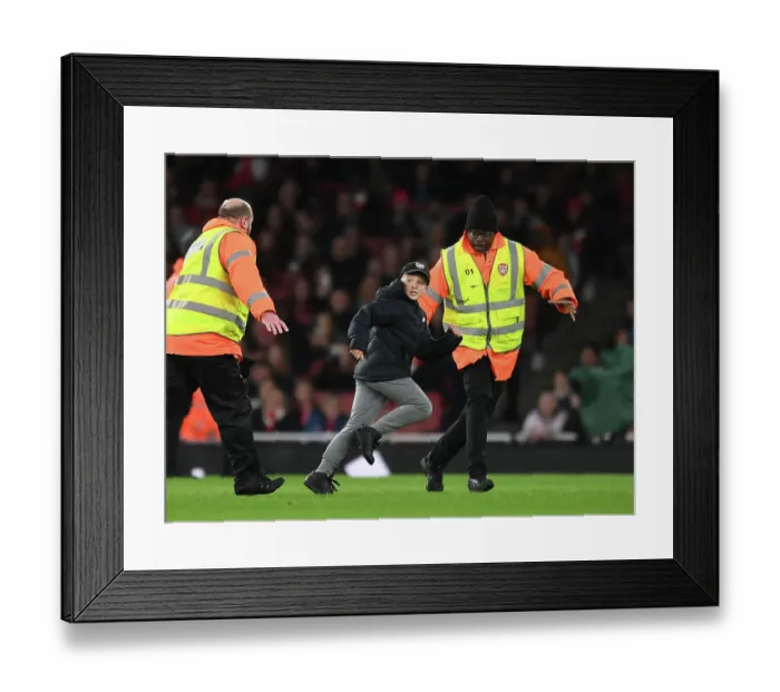Framed Print : Pitch Intruder Disrupts Arsenal Women vs Manchester United Women FA WSL Match at Emirates Stadium (2022-23)