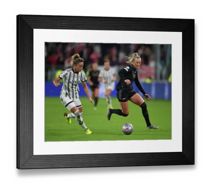 Framed Print : Battle in Group C: Juventus vs. Arsenal - UEFA Women's Champions League: Stina Blackstenius Faces Off Against Martina Rosucci