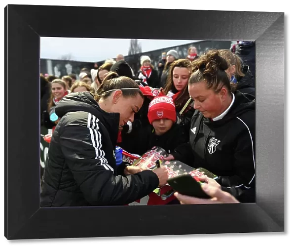 Arsenal's Katie McCabe Celebrates Victory and Greets Fans with Autographs
