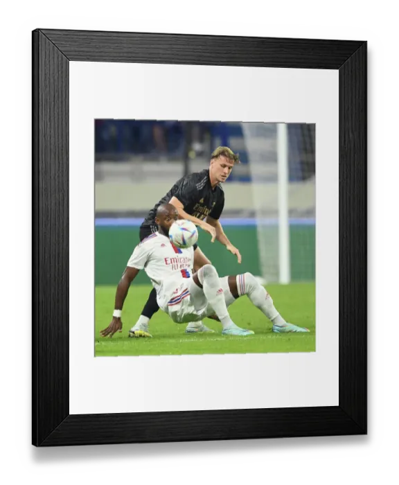 Framed Print : Arsenal vs. Olympique Lyonnais: A Battle in the Dubai Super Cup