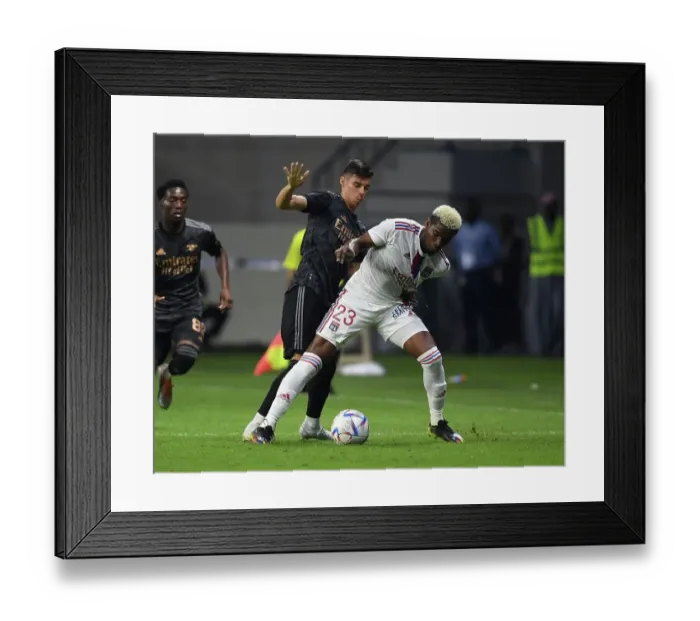 Framed Print : Arsenal vs. Olympique Lyonnais: A Fierce Battle in the Dubai Super Cup Framed Print : Arsenal vs. Olympique Lyonnais: A Fierce Battle in the Dubai Super Cup