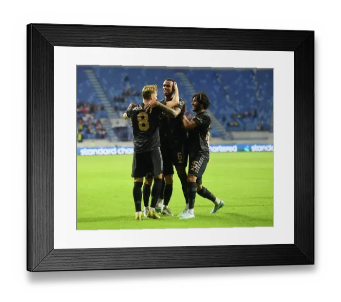 Framed Print : Arsenal Celebrate First Goal Against Olympique Lyonnais in Dubai Super Cup