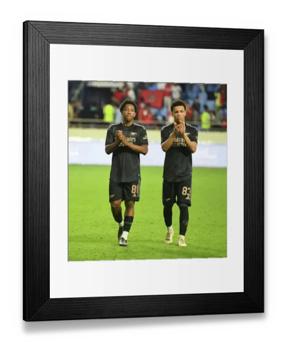 Framed Print : Arsenal and Olympique Lyonnais Clash in Dubai Super Cup: Fans Celebrate