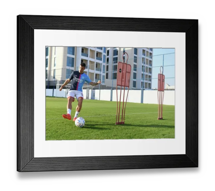 Framed Print : Granit Xhaka Prepares for Arsenal vs AC Milan: Arsenal Football Club's Training Session, Dubai Super Cup 2022