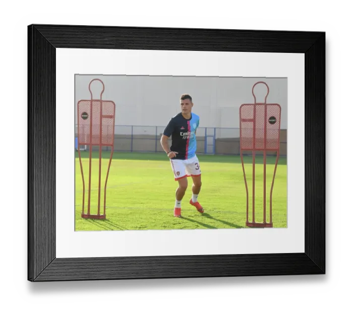 Framed Print : Arsenal's Granit Xhaka Gears Up: Arsenal FC vs AC Milan, Dubai Super Cup 2022