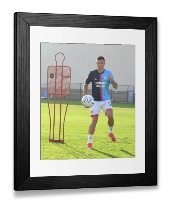 Framed Print : Granit Xhaka Prepares for Arsenal vs AC Milan: Arsenal FC Training Session, Dubai Super Cup 2022