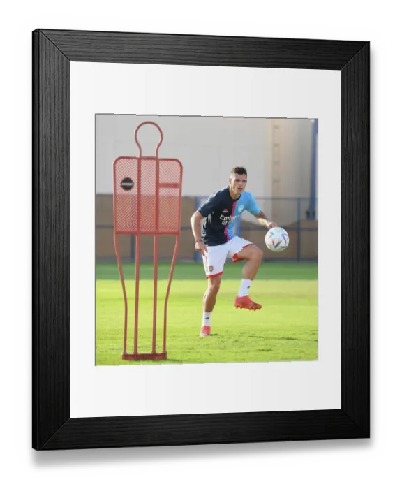 Framed Print : Arsenal FC vs AC Milan: Granit Xhaka Leads Arsenal Players in Training Before Dubai Super Cup Clash, 2022