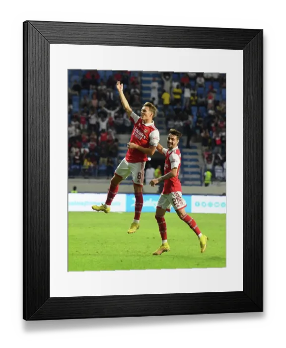 Framed Print : Arsenal's Odegaard and Vieira Celebrate Goals Against AC Milan in Dubai Super Cup Framed Print : Arsenal's Odegaard and Vieira Celebrate Goals Against AC Milan in Dubai Super Cup