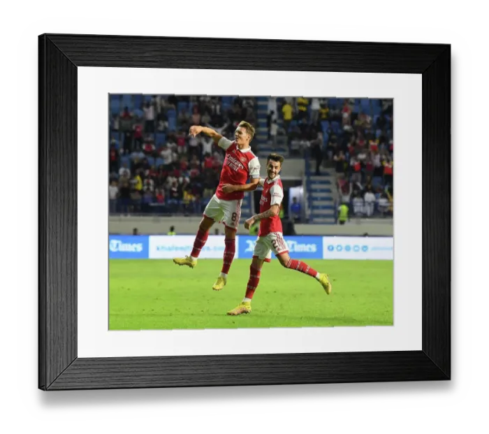 Framed Print : Arsenal's Odegaard and Vieira: Celebrating Goals Against AC Milan at Dubai Super Cup Framed Print : Arsenal's Odegaard and Vieira: Celebrating Goals Against AC Milan at Dubai Super Cup