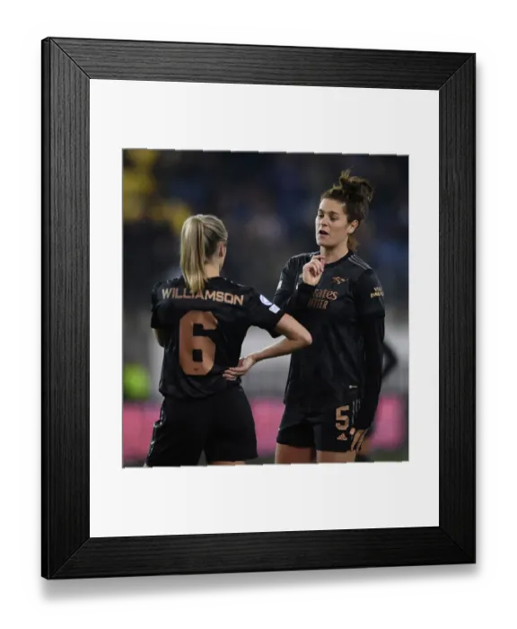 Framed Print : Arsenal Women in Deep Conversation During UEFA Champions League Match Against FC Zürich: Jennifer Beattie and Leah Williamson